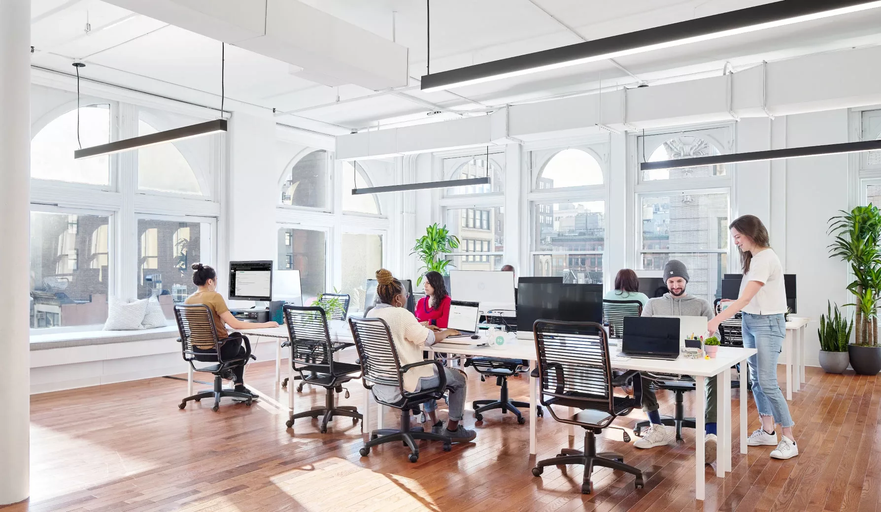 Ro employees sitting at desks in the Ro NYC HQ