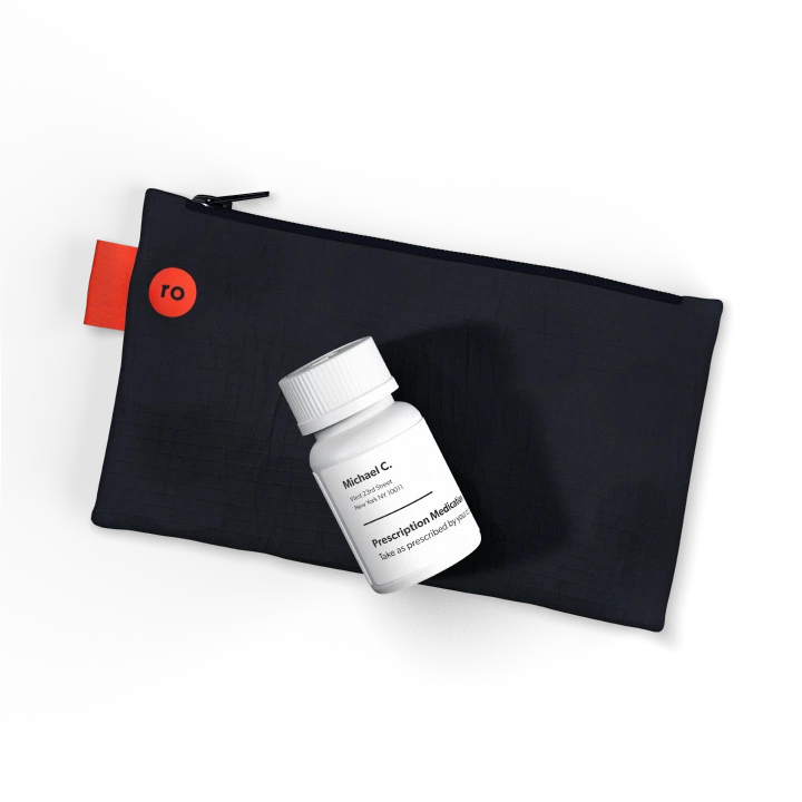 White pill bottle and black zipper case